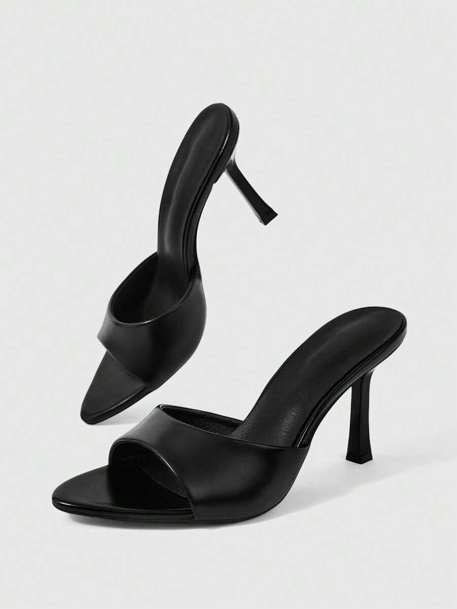 Women's high-heeled slippers in PU leather featuring an open plain toe, belt detail, and stiletto high heel with TPR outsole.