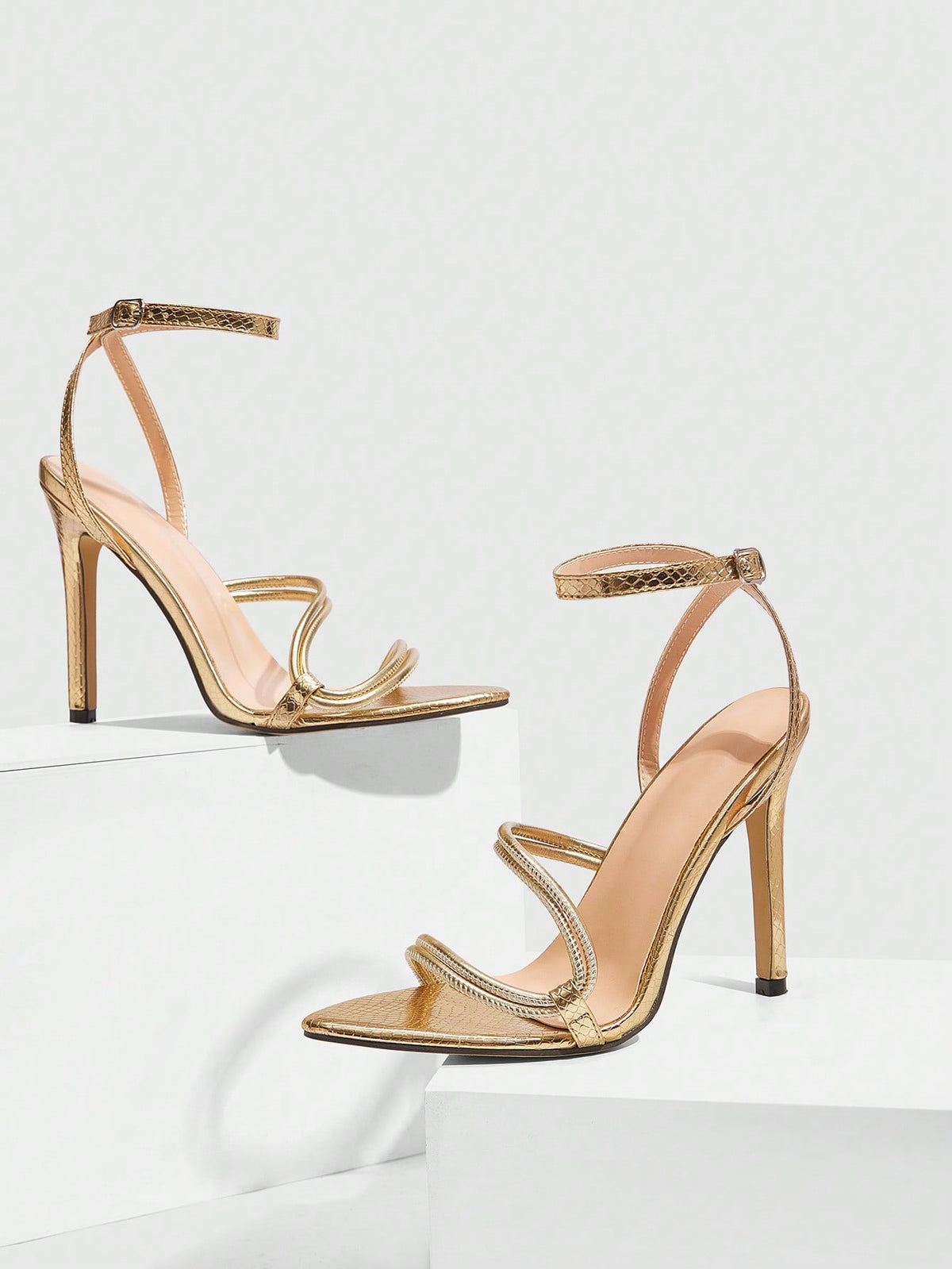 Snake pattern open toe high heel sandals with thin stiletto heel and buckle ankle strap for women.
