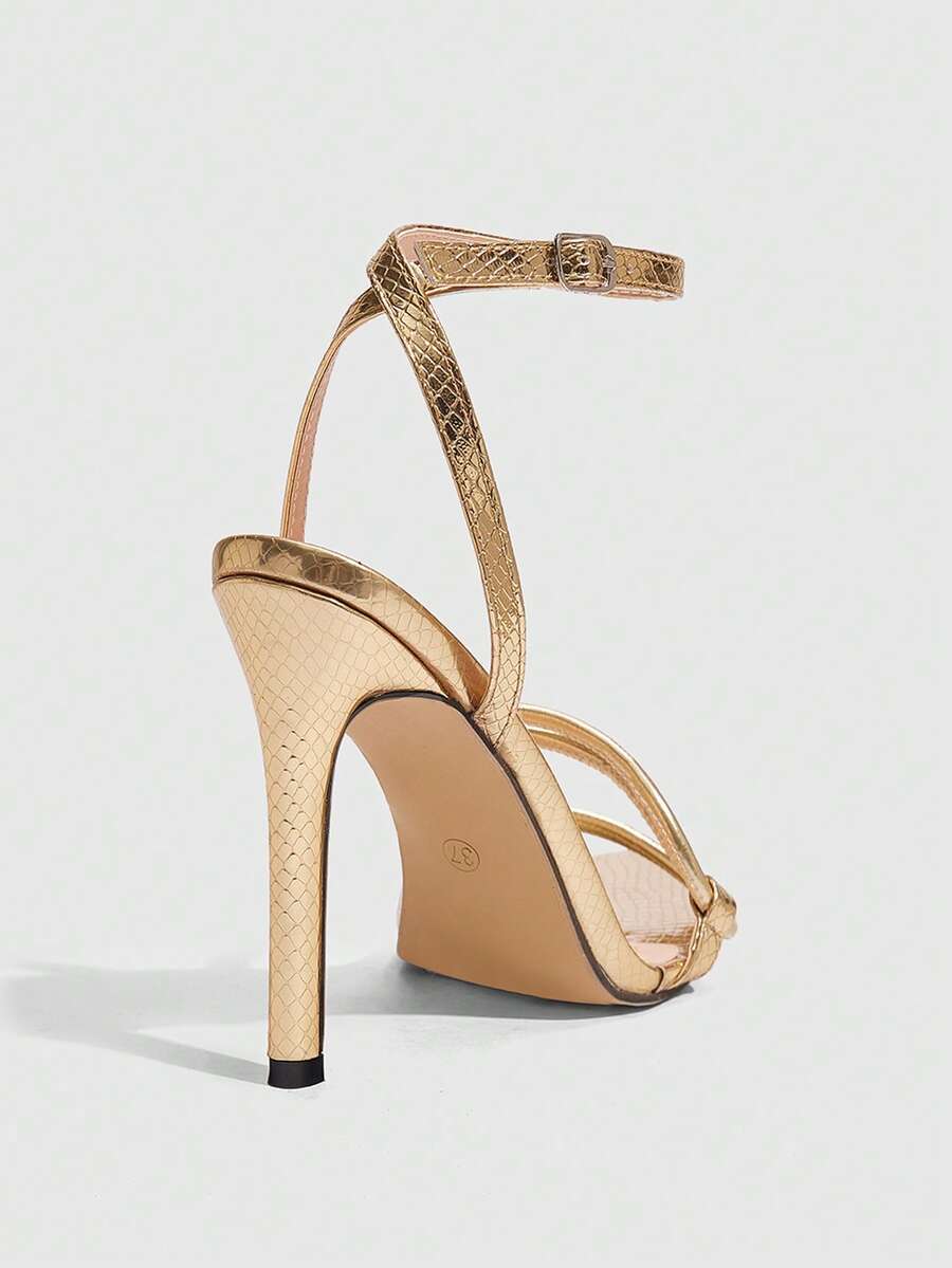 Snake pattern open toe high heel sandals with thin stiletto heel and buckle ankle strap for women.