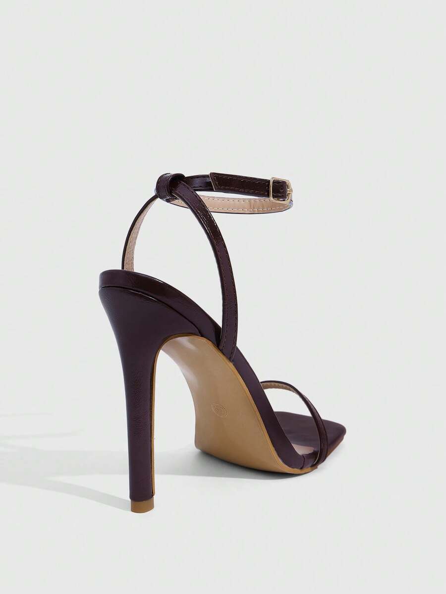 Elegant women's open toe strappy heeled sandals with stiletto high heel and ankle strap buckle closure.