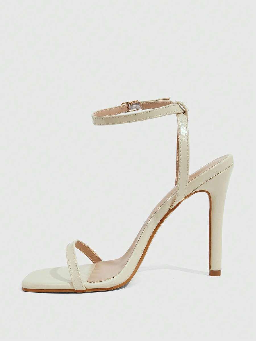 Elegant women's open toe strappy heeled sandals with stiletto high heel and ankle strap buckle closure.