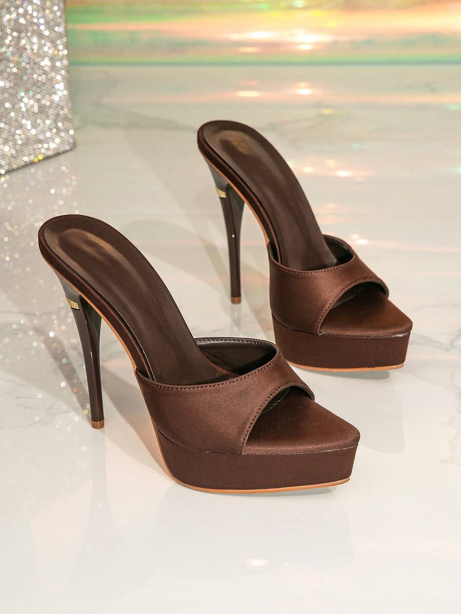 Women's thick platform high heel sandals featuring a pointed open toe design, ultra high stiletto heel, and sleek ankle slingback strap.