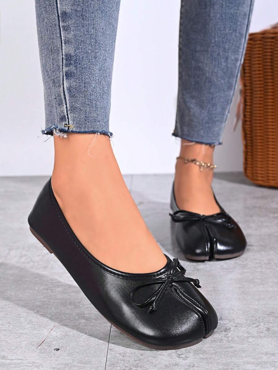 Women's white split-toe slip-on flat shoes with braided accent and rubber sole