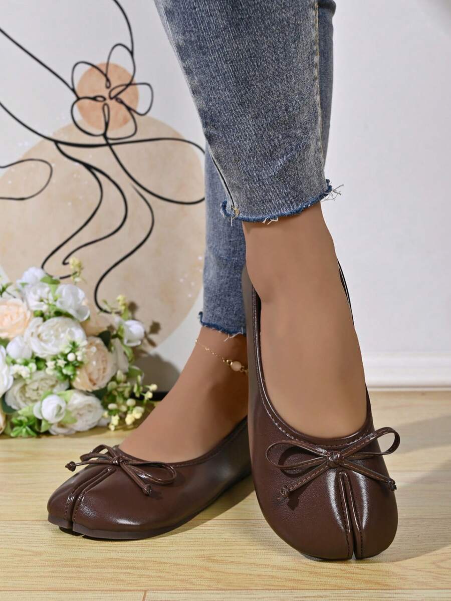 Women's white split-toe slip-on flat shoes with braided accent and rubber sole