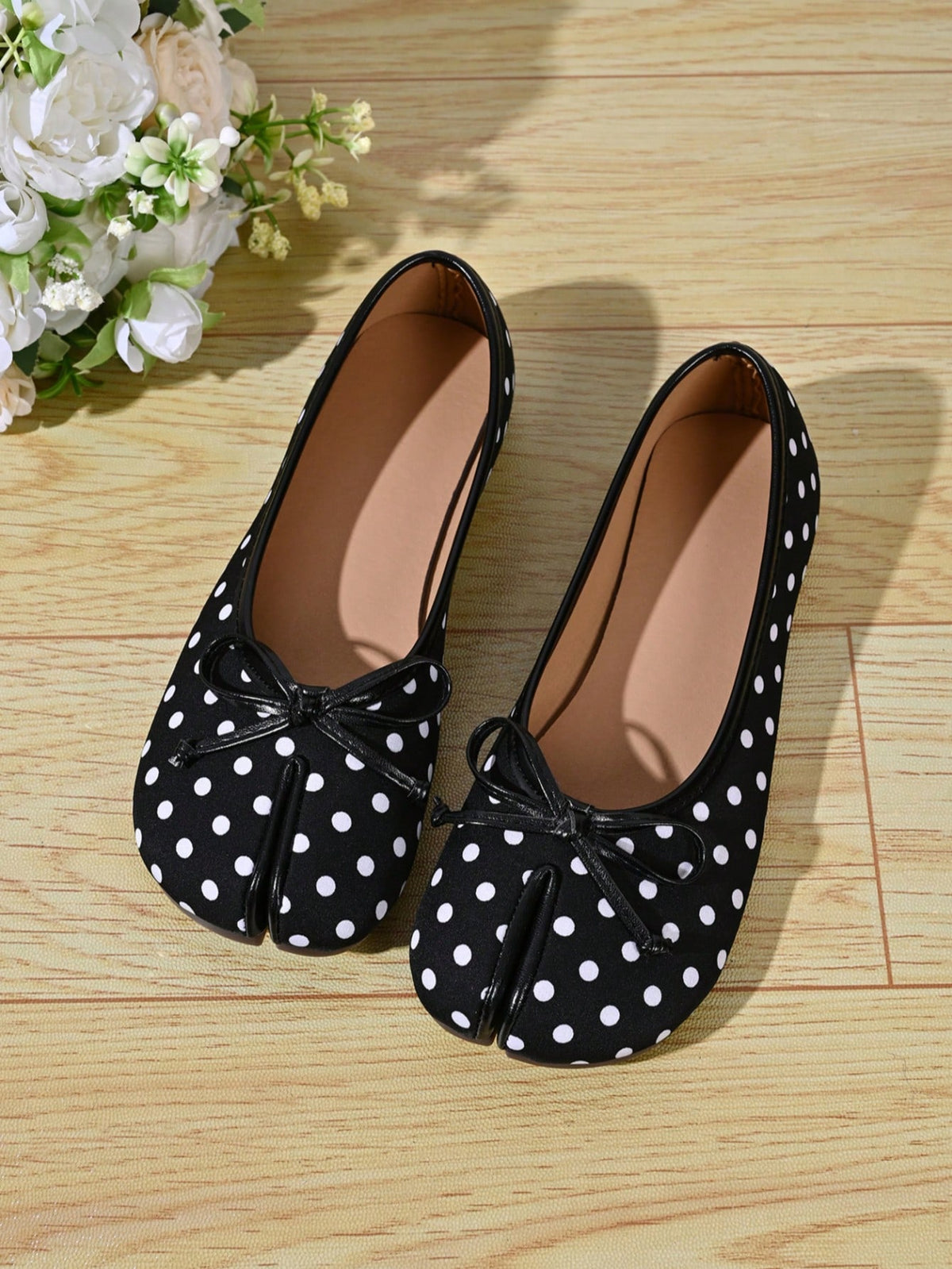 Women's white split-toe slip-on flat shoes with braided accent and rubber sole