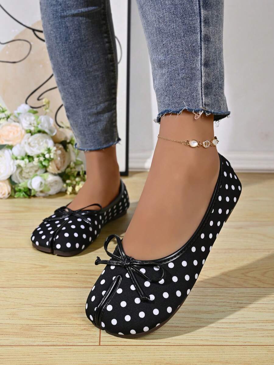 Women's white split-toe slip-on flat shoes with braided accent and rubber sole