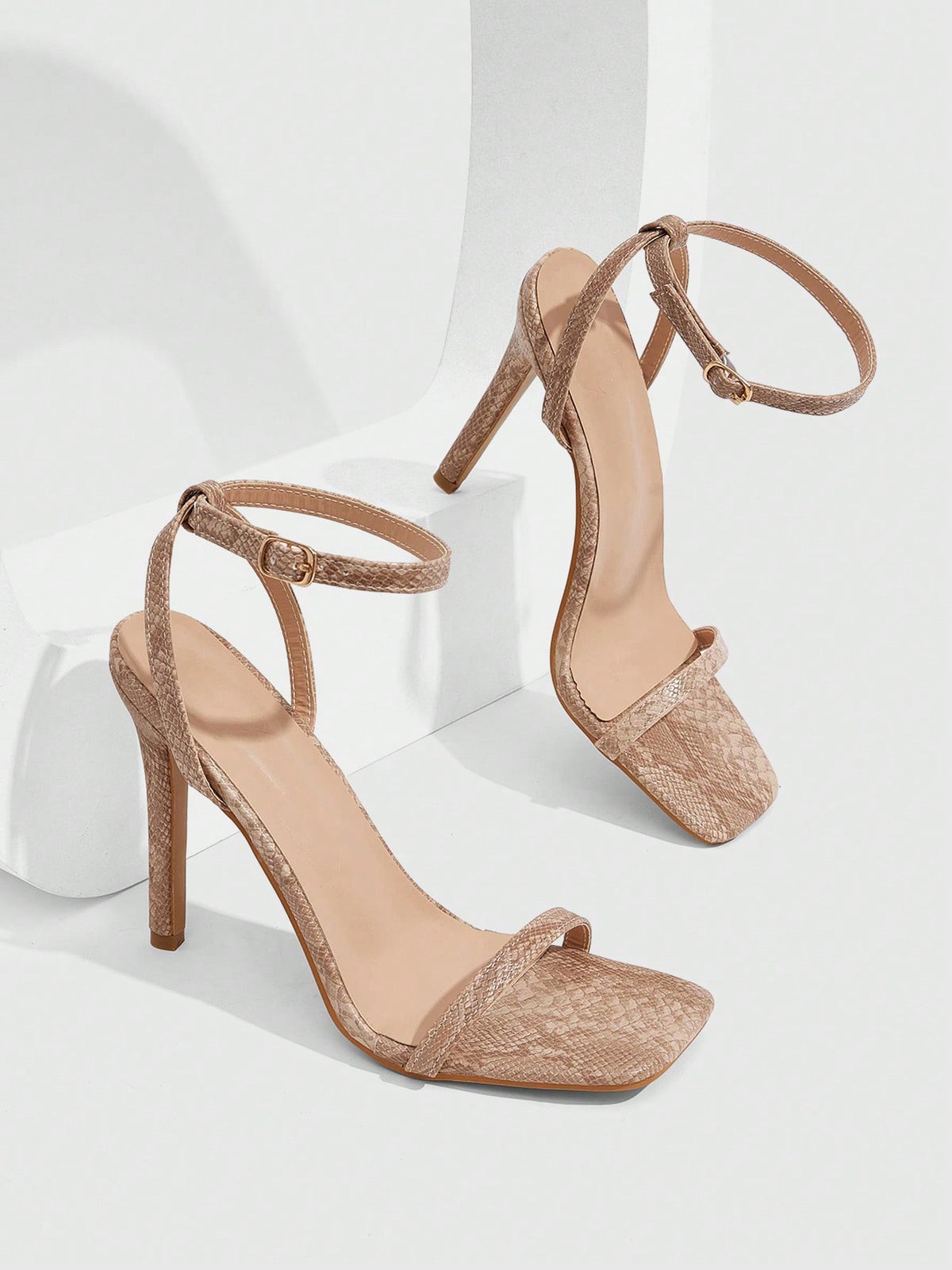 Elegant women's open toe strappy heeled sandals with stiletto high heel and ankle strap buckle closure.