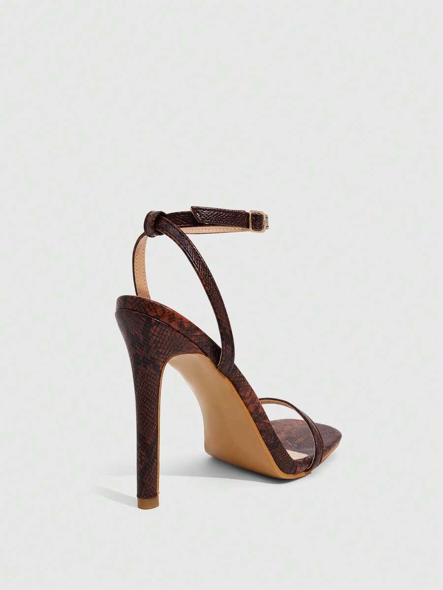 Elegant women's open toe strappy heeled sandals with stiletto high heel and ankle strap buckle closure.