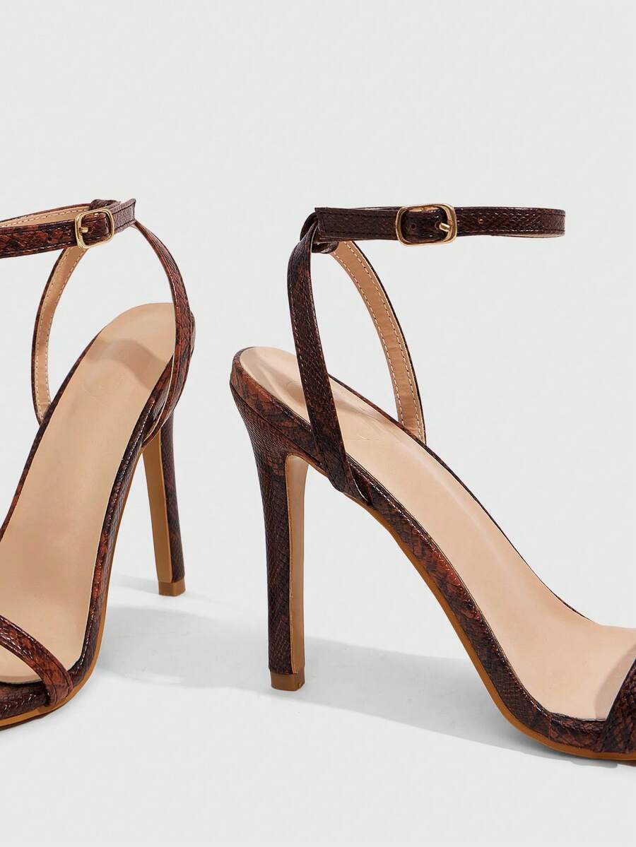 Elegant women's open toe strappy heeled sandals with stiletto high heel and ankle strap buckle closure.