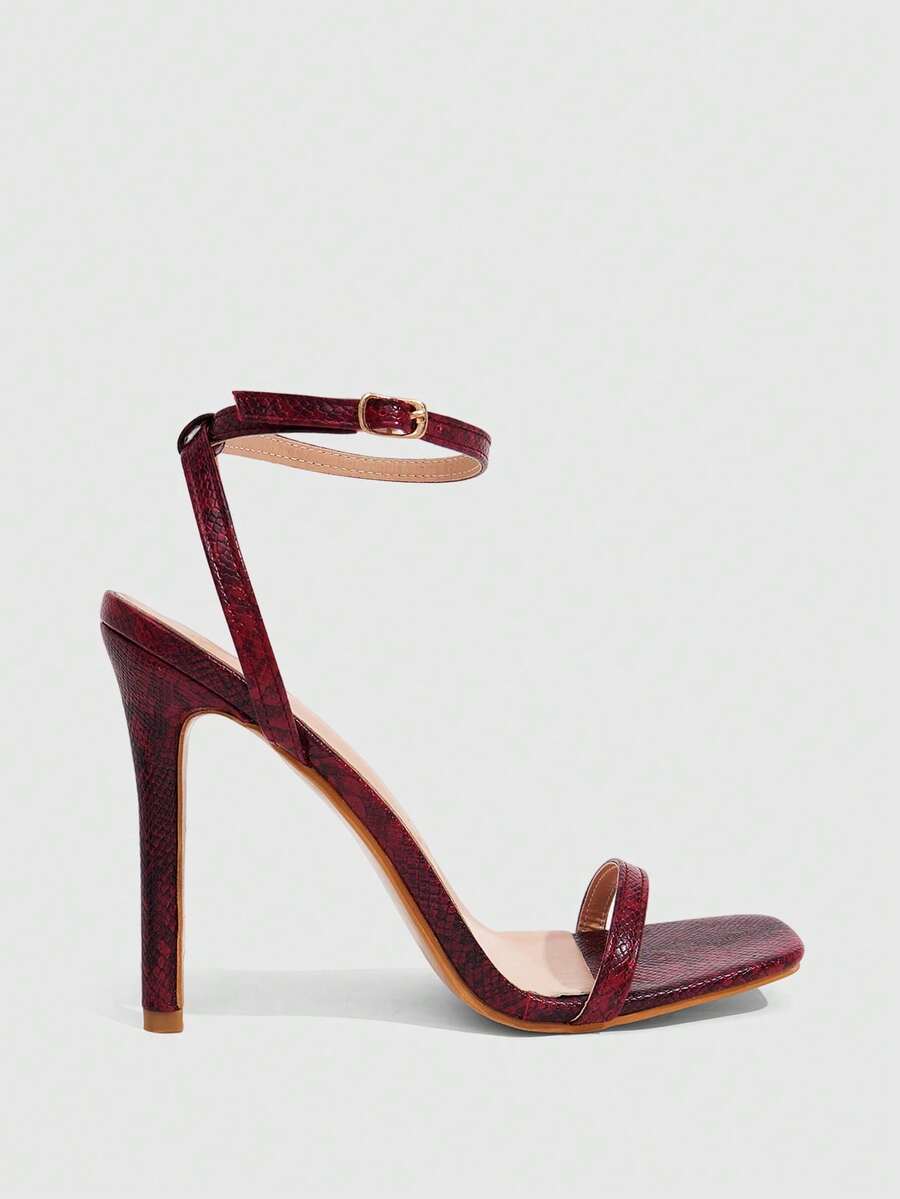 Elegant women's open toe strappy heeled sandals with stiletto high heel and ankle strap buckle closure.