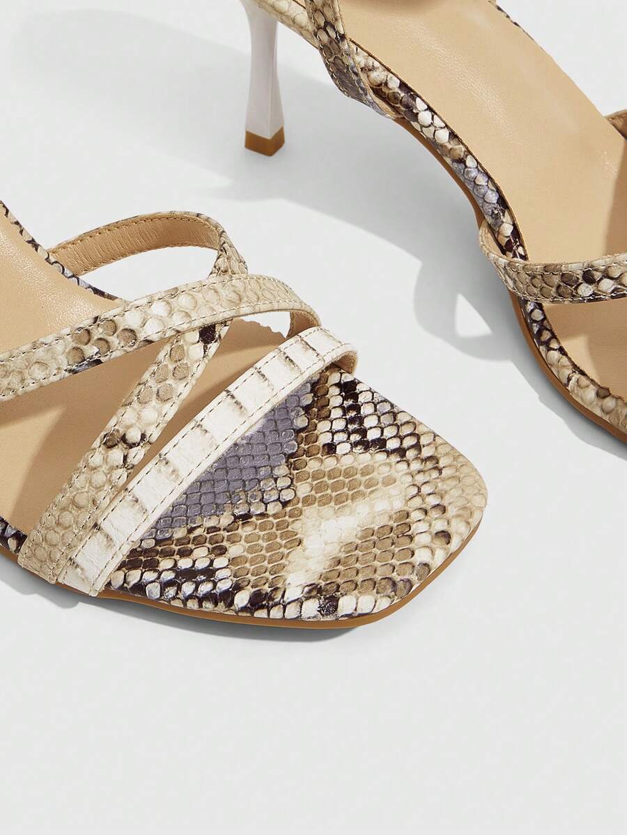 Square toe stiletto high heel sandals with crisscross strappy design and adjustable ankle buckle strap in light blue.