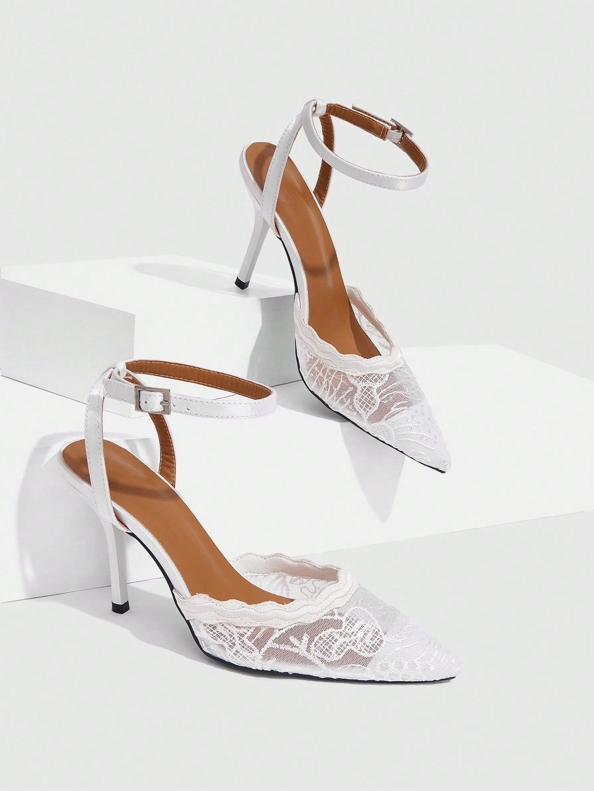 Women's stiletto high heel shoes featuring an elegant buckle detail and ankle strap slingback design.