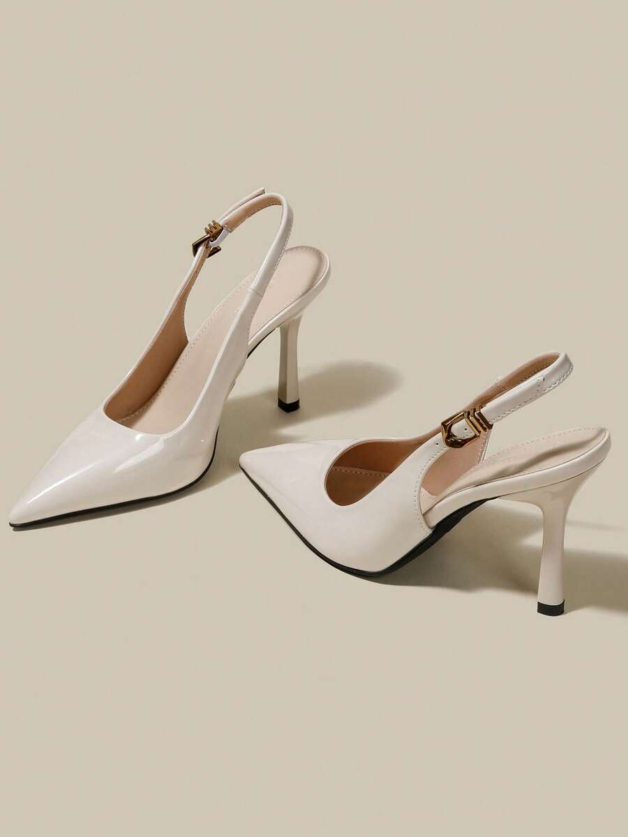 Women's pointed toe kitten heel pumps with adjustable buckle back strap and sleek patent finish.