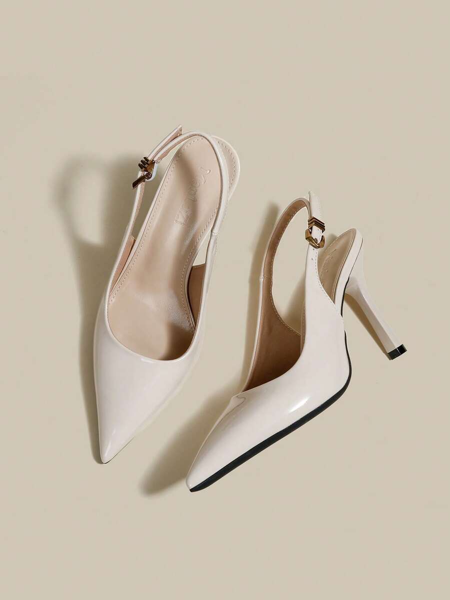 Women's pointed toe kitten heel pumps with adjustable buckle back strap and sleek patent finish.