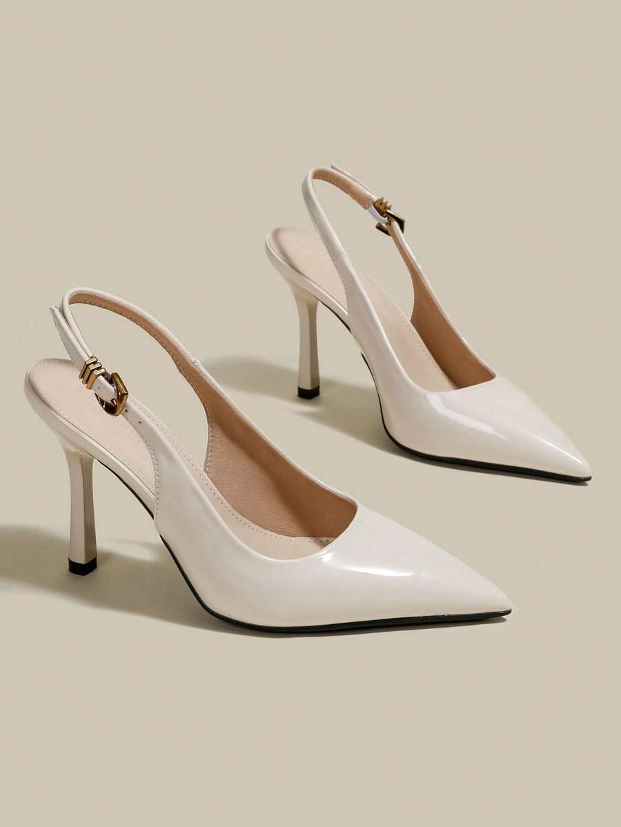 Women's pointed toe kitten heel pumps with adjustable buckle back strap and sleek patent finish.