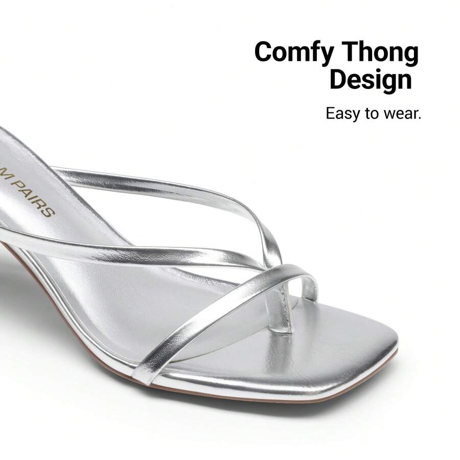 Women's metallic kitten low heel thong sandals featuring an open square toe and slip-on mule design.