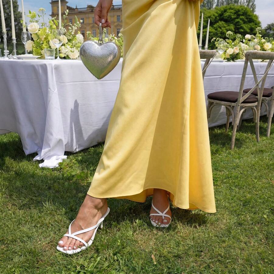 Women's metallic kitten low heel thong sandals featuring an open square toe and slip-on mule design.
