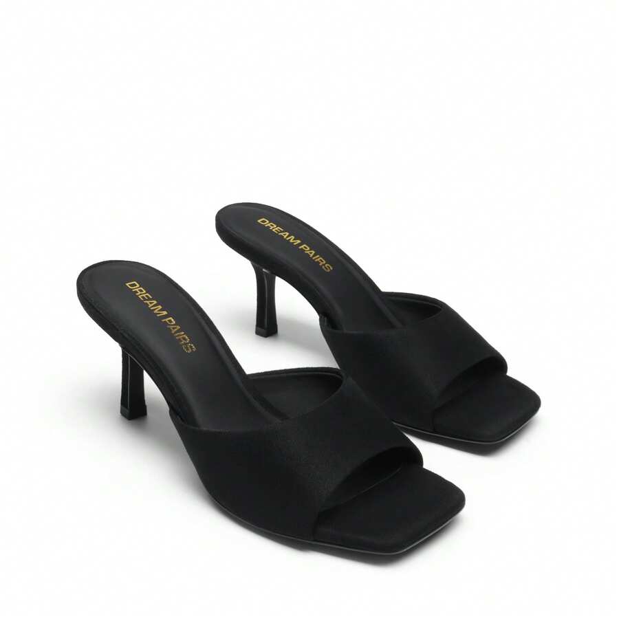 Pair of women's open square toe kitten heel mule sandals in white PU leather with slip-on styling.