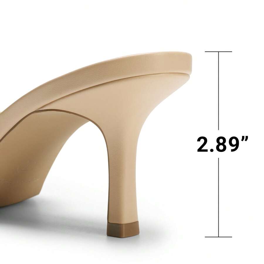 Pair of women's open square toe kitten heel mule sandals in white PU leather with slip-on styling.
