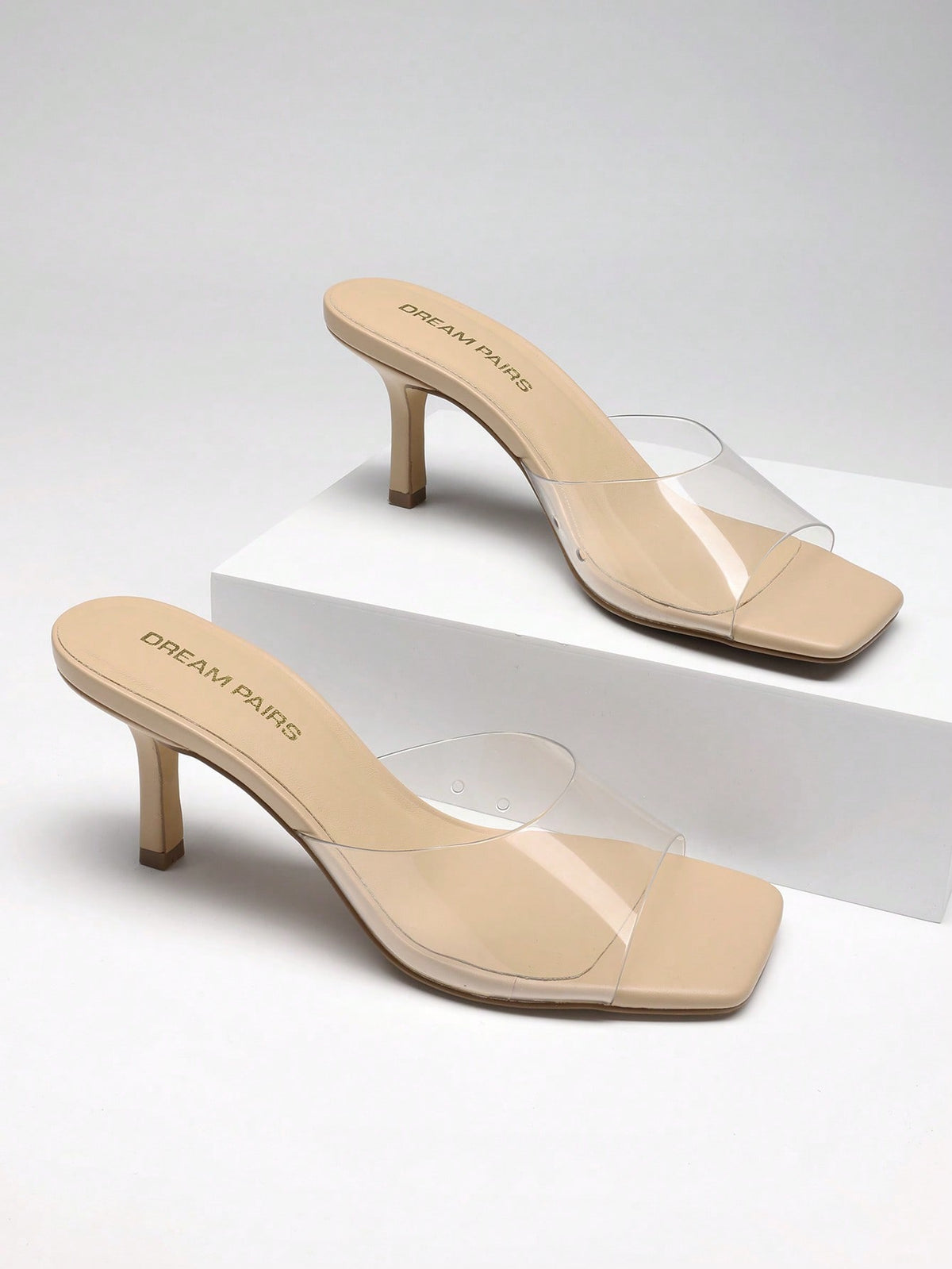 Pair of women's open square toe kitten heel mule sandals in white PU leather with slip-on styling.