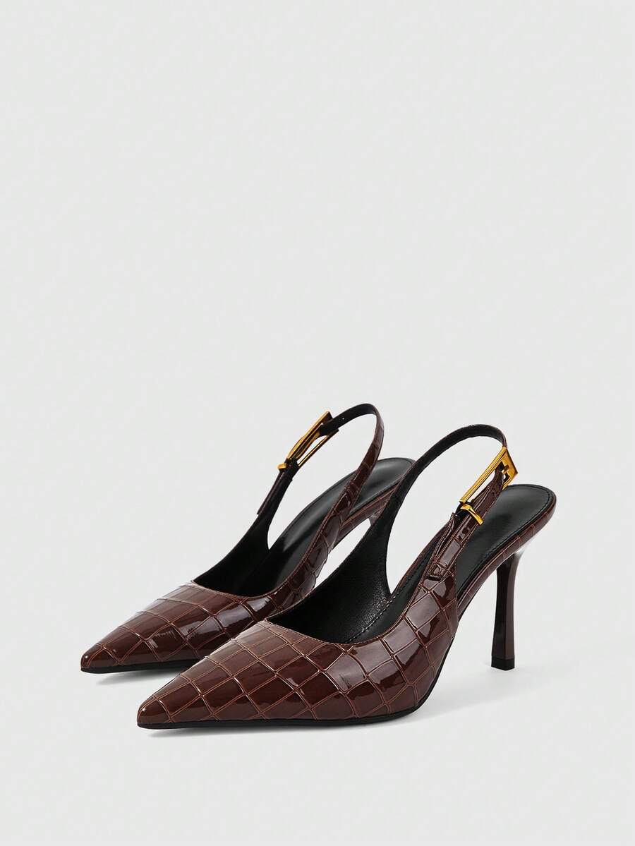 Women's pointed-toe high heel pumps in black mirror PU leather with an ankle strap, stiletto heel, and rhinestone buckle.