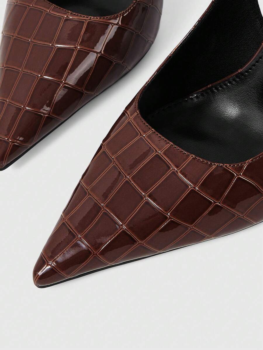Women's pointed-toe high heel pumps in black mirror PU leather with an ankle strap, stiletto heel, and rhinestone buckle.