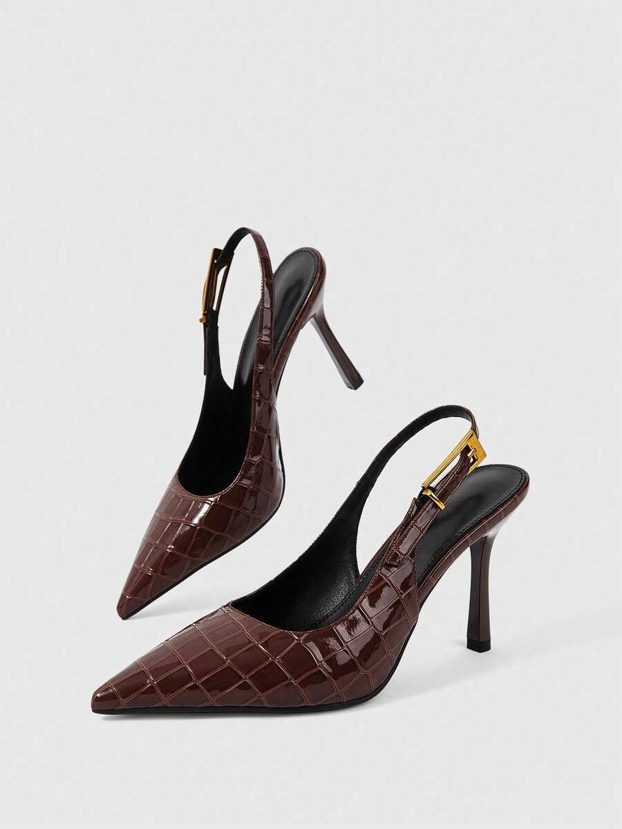 Women's pointed-toe high heel pumps in black mirror PU leather with an ankle strap, stiletto heel, and rhinestone buckle.