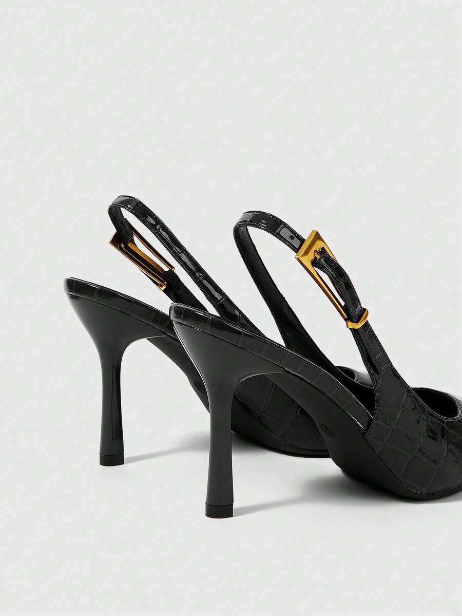 Women's pointed-toe high heel pumps in black mirror PU leather with an ankle strap, stiletto heel, and rhinestone buckle.