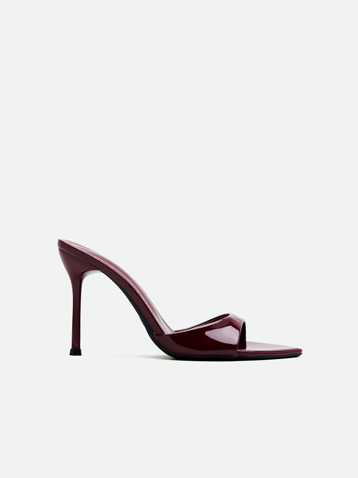Burgundy women's high heel open-toe mules with stiletto heel and slingback strap designed for evening parties and wedding events.