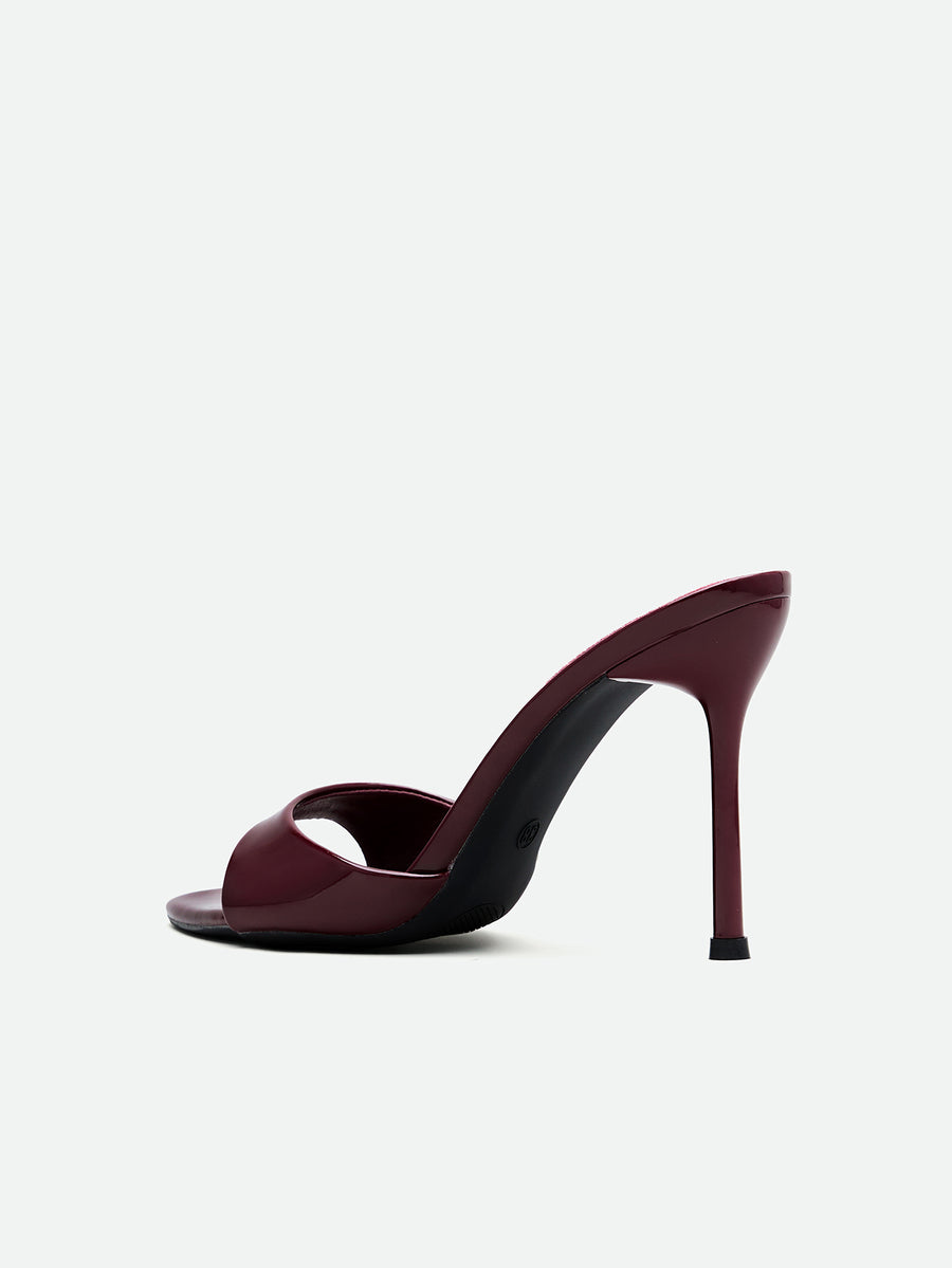Burgundy women's high heel open-toe mules with stiletto heel and slingback strap designed for evening parties and wedding events.