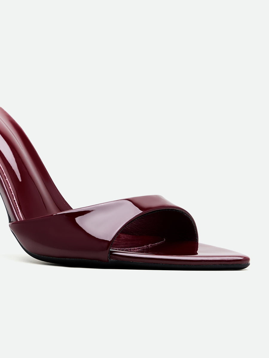 Burgundy women's high heel open-toe mules with stiletto heel and slingback strap designed for evening parties and wedding events.