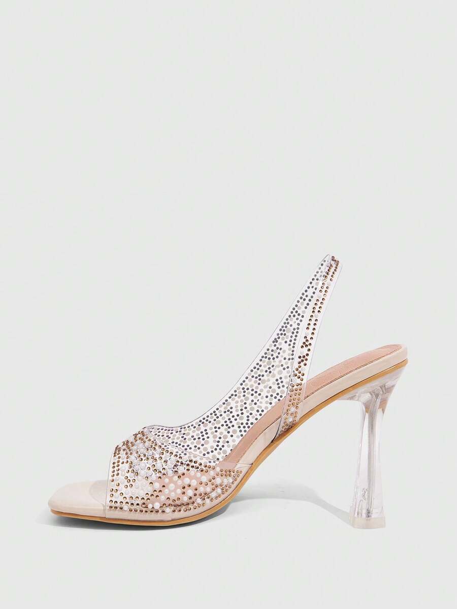 Women's square toe heeled sandals with clear straps, sparkling rhinestone embellishments, and a high pyramid heel.