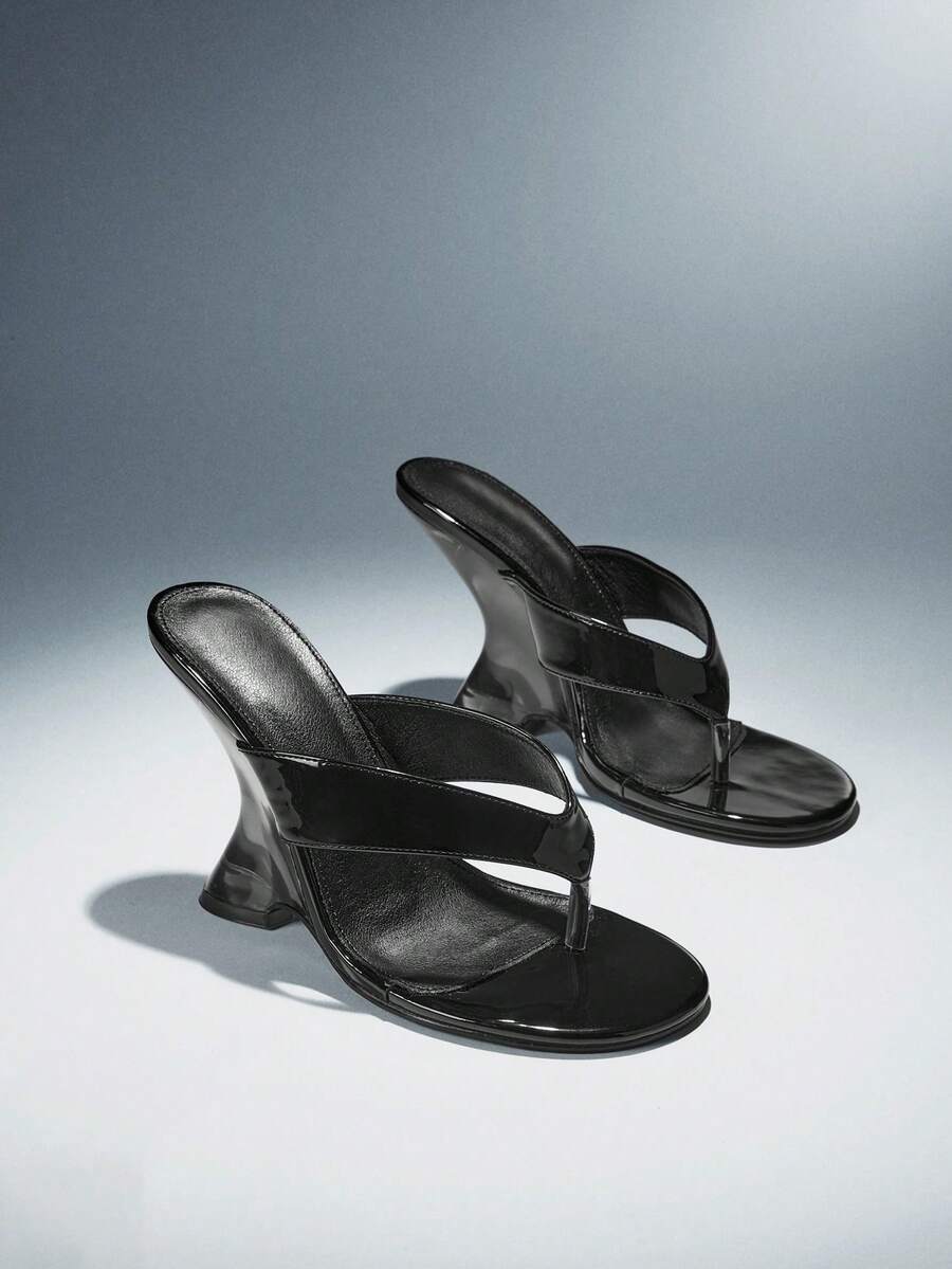 Women's slip-on thong strap wedge sandals featuring a high wedge heel and smooth PU leather upper.