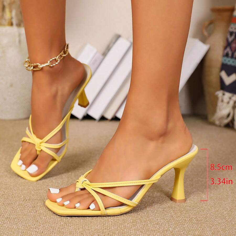 Women's high heel thong sandals featuring sparkling rhinestone buckle accents, slender stiletto thin heel, toe post, and cross straps.