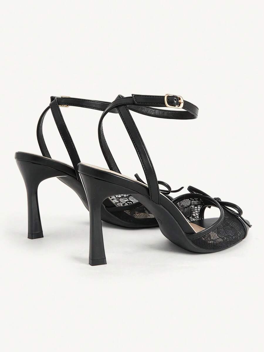 Women's open toe high heel sandals with lace mesh upper, stiletto heel, and ankle strap closure.