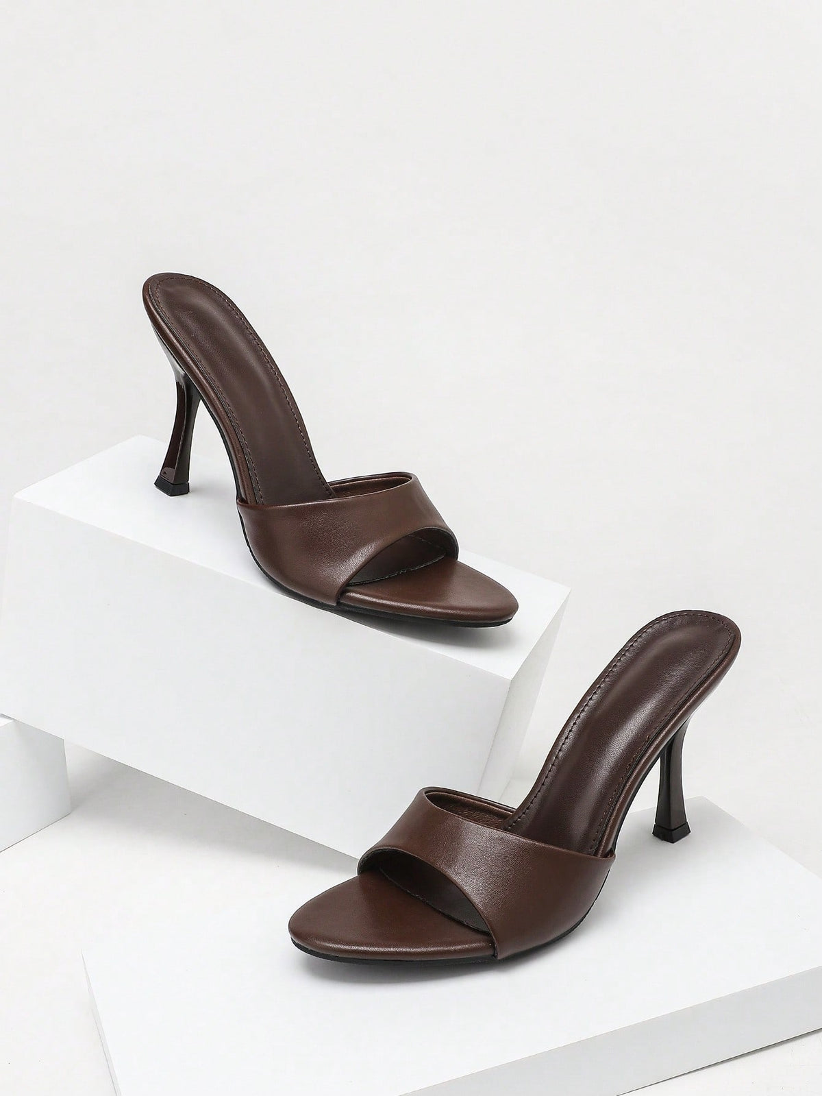 Women's open toe high heel sandals with slingback strap and sleek stiletto heel in smooth PU leather.