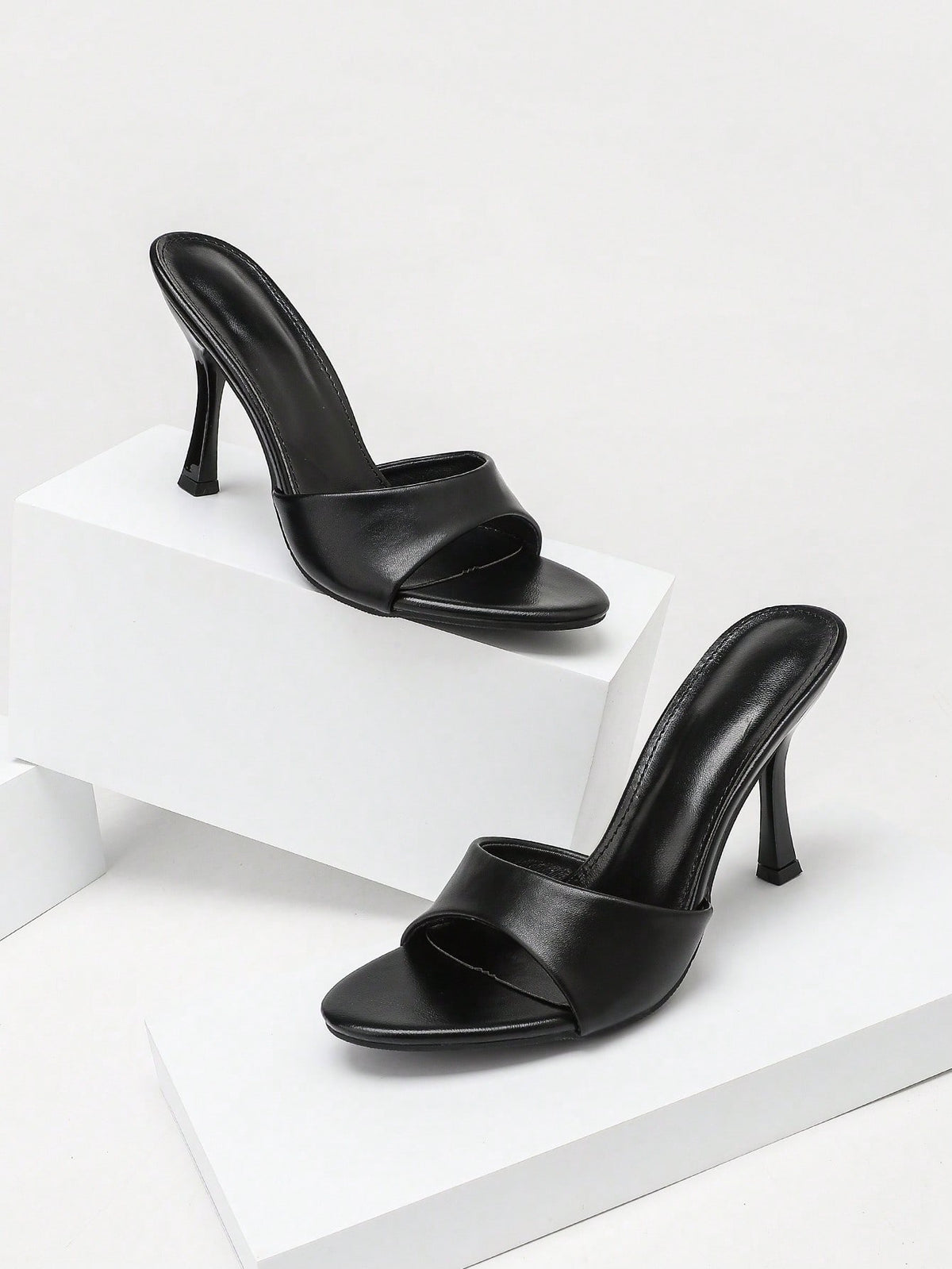 Women's open toe high heel sandals with slingback strap and sleek stiletto heel in smooth PU leather.