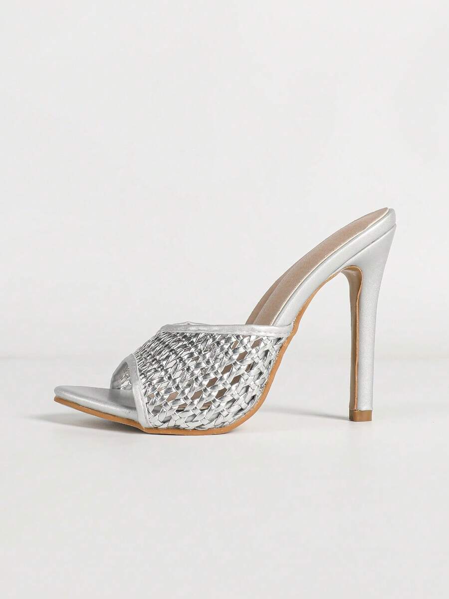 Women's black patent strap pointed toe high heel sandals featuring a stiletto heel and open hollow-out slingback design.