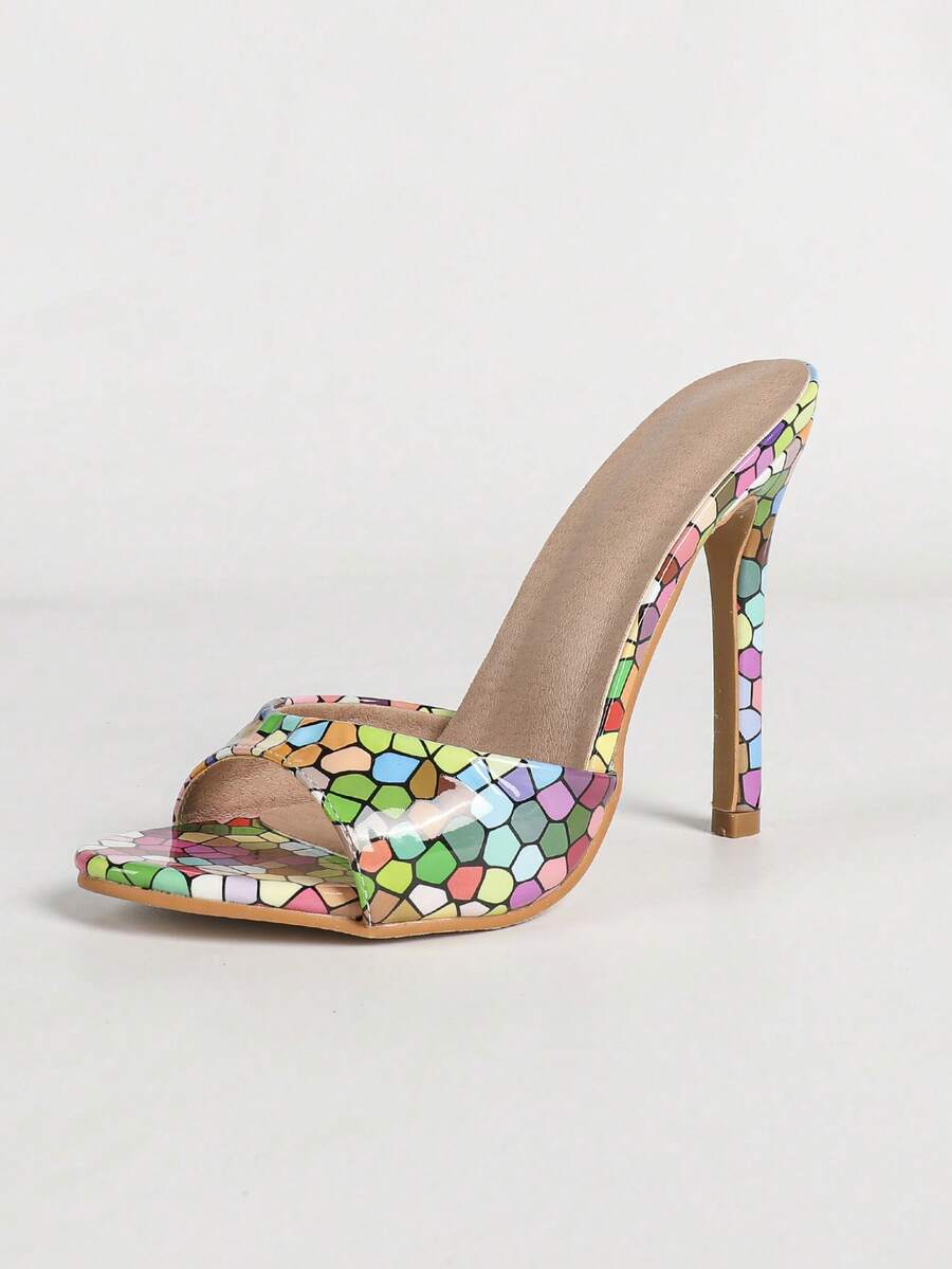Women's black patent strap pointed toe high heel sandals featuring a stiletto heel and open hollow-out slingback design.