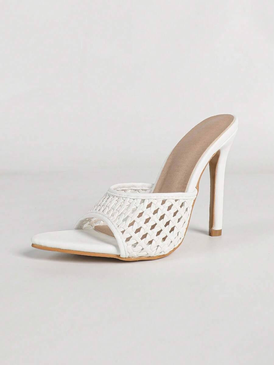 Women's black patent strap pointed toe high heel sandals featuring a stiletto heel and open hollow-out slingback design.