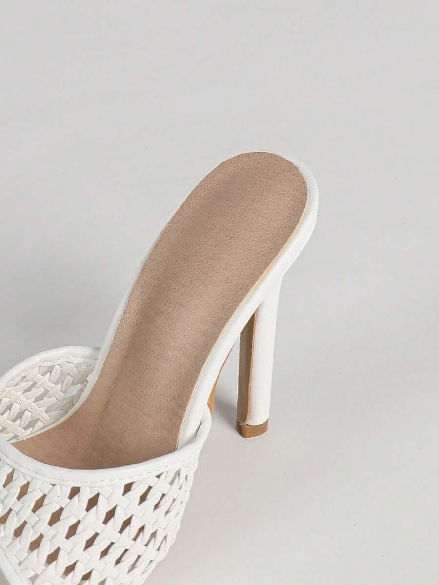 Women's black patent strap pointed toe high heel sandals featuring a stiletto heel and open hollow-out slingback design.