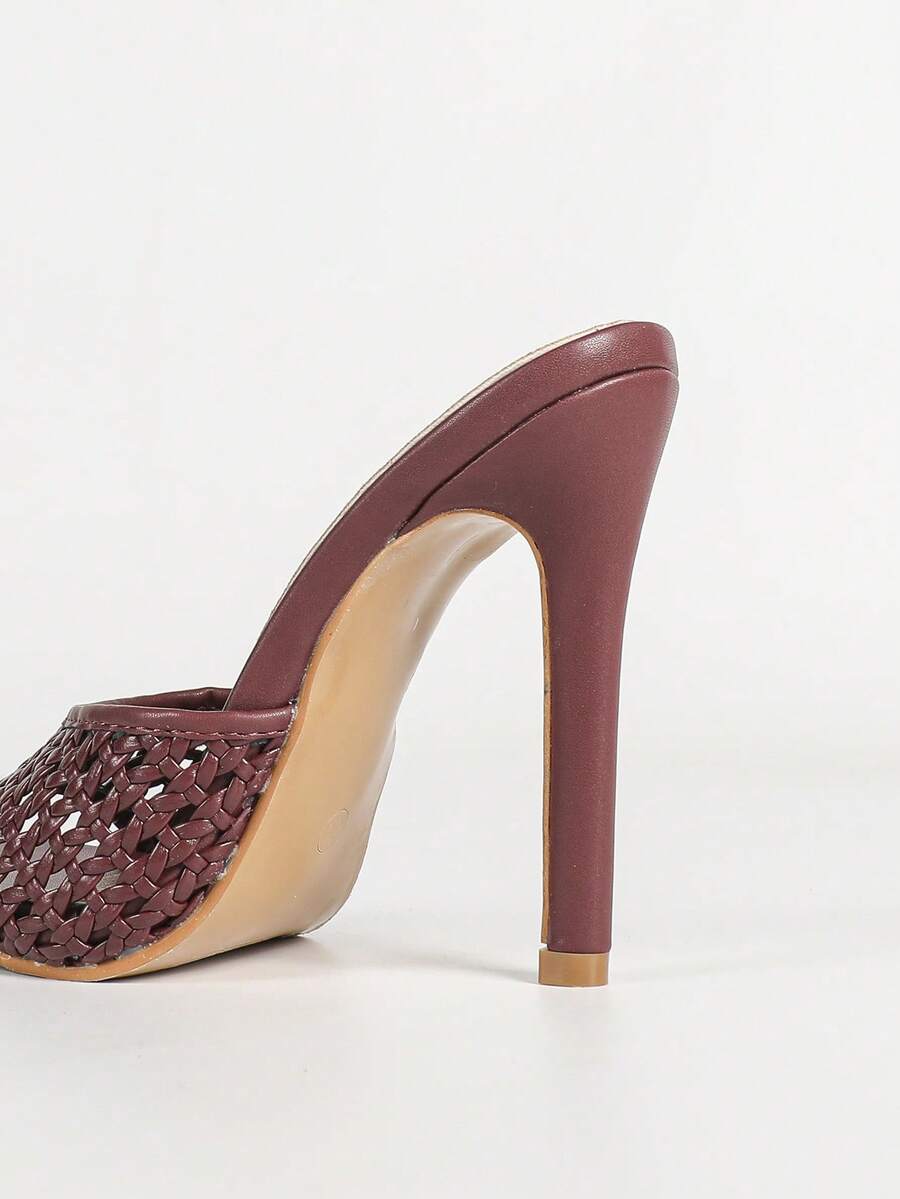 Women's black patent strap pointed toe high heel sandals featuring a stiletto heel and open hollow-out slingback design.
