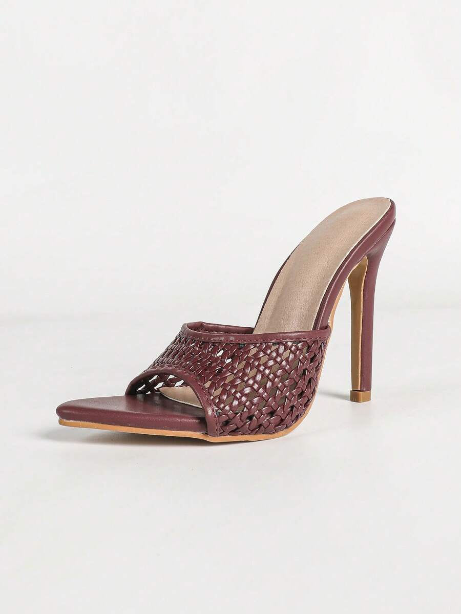 Women's black patent strap pointed toe high heel sandals featuring a stiletto heel and open hollow-out slingback design.