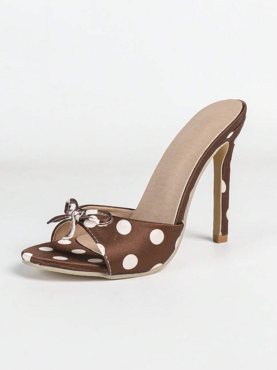 Women's black patent strap pointed toe high heel sandals featuring a stiletto heel and open hollow-out slingback design.