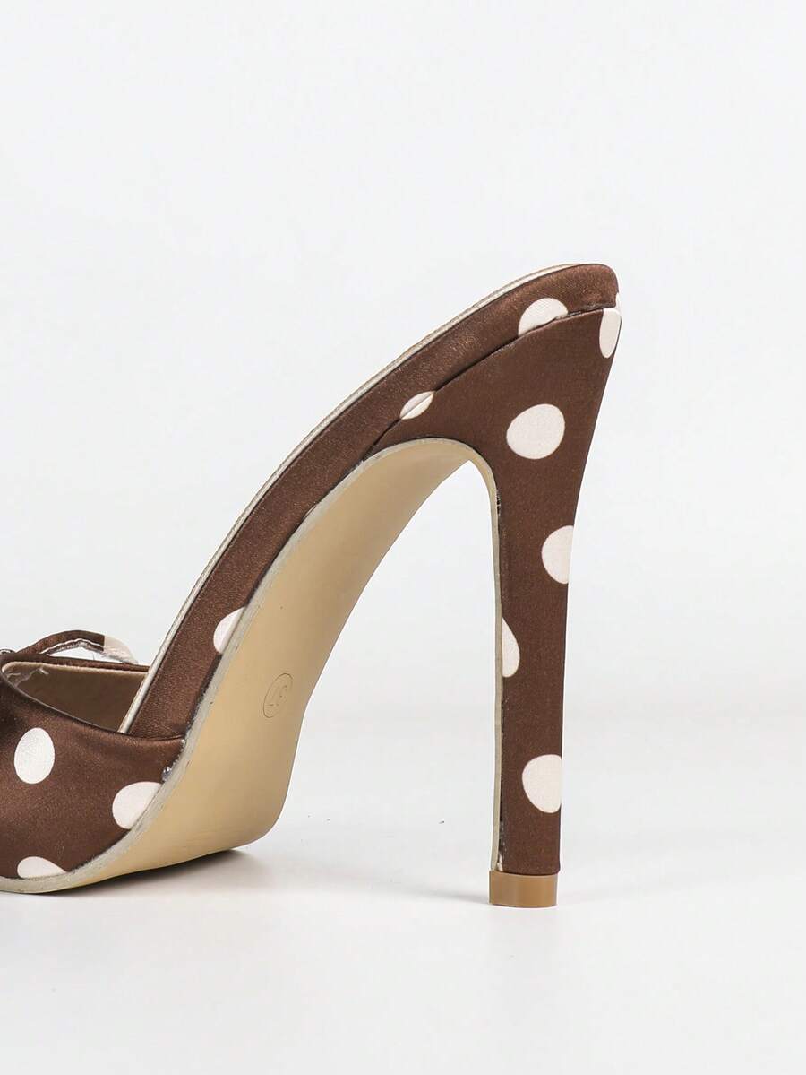 Women's black patent strap pointed toe high heel sandals featuring a stiletto heel and open hollow-out slingback design.