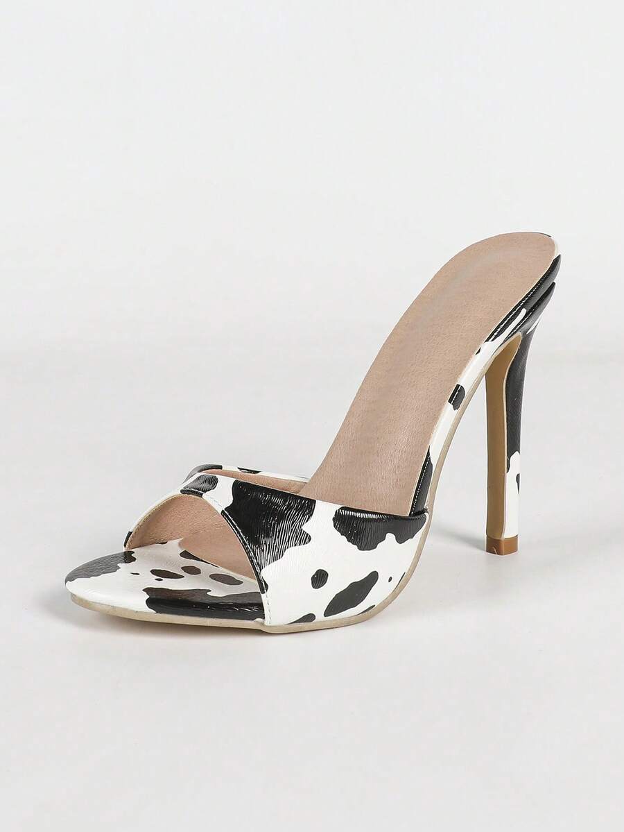 Women's black patent strap pointed toe high heel sandals featuring a stiletto heel and open hollow-out slingback design.