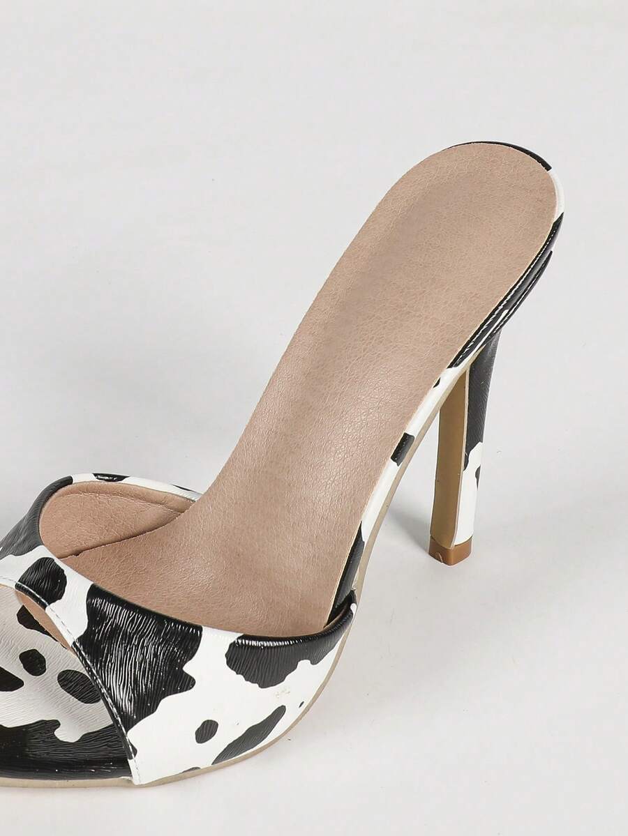 Women's black patent strap pointed toe high heel sandals featuring a stiletto heel and open hollow-out slingback design.