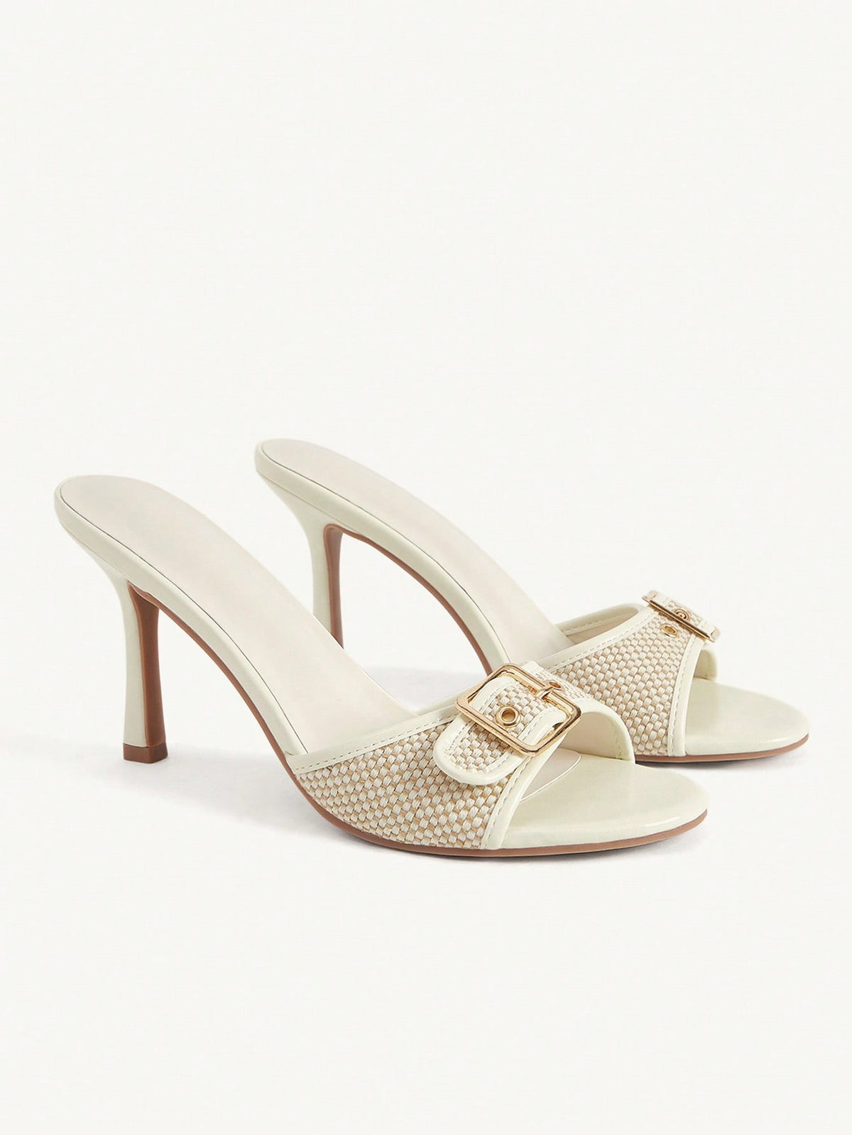 Women's brown leopard print high heel mule sandals with gold-tone buckle and grommet eyelet accents.