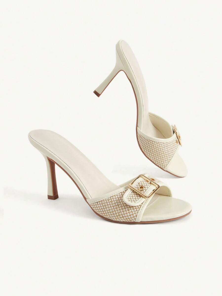 Women's brown leopard print high heel mule sandals with gold-tone buckle and grommet eyelet accents.
