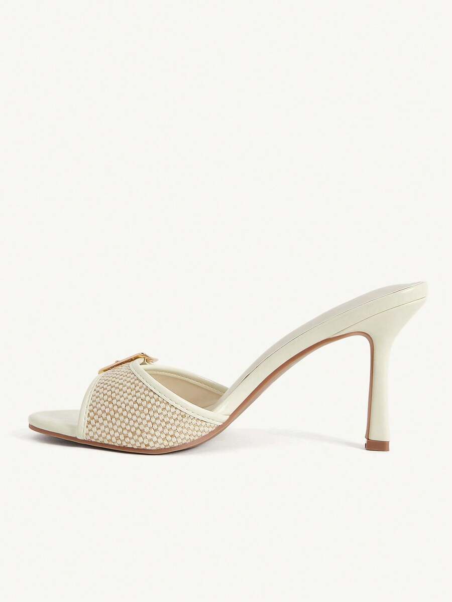 Women's brown leopard print high heel mule sandals with gold-tone buckle and grommet eyelet accents.